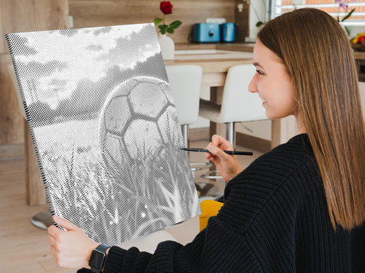 Mal-med-prikker - Fodbold ved solnedgang